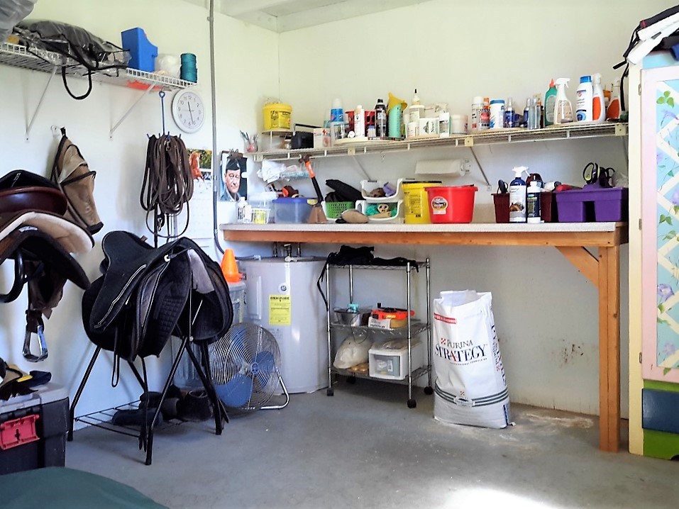 spacious feed & tack room. water heater for the wash area hot water.