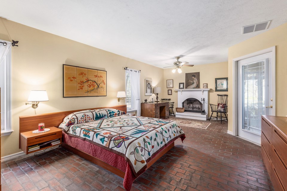 master suite has a fireplace and porch access