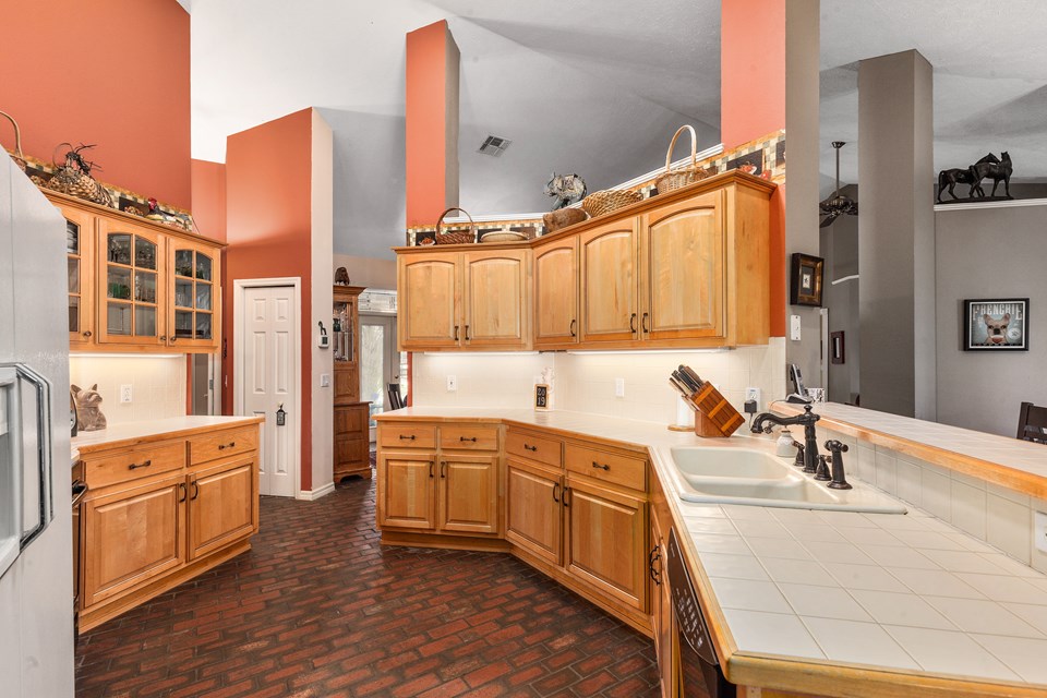 custom wood cabinets and eat-at bar in the kitchen