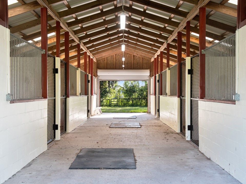 eight airy stalls, almost 12'x12', have a concrete kick edge and led lights