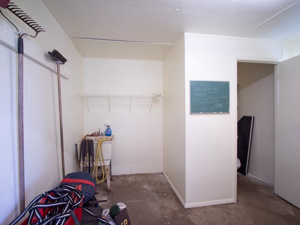 feed room has a laundry tub and water closet