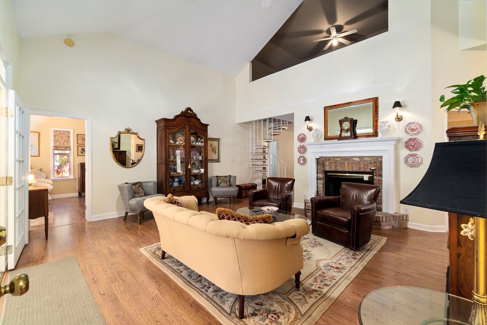 living room withj antique brick fireplace
