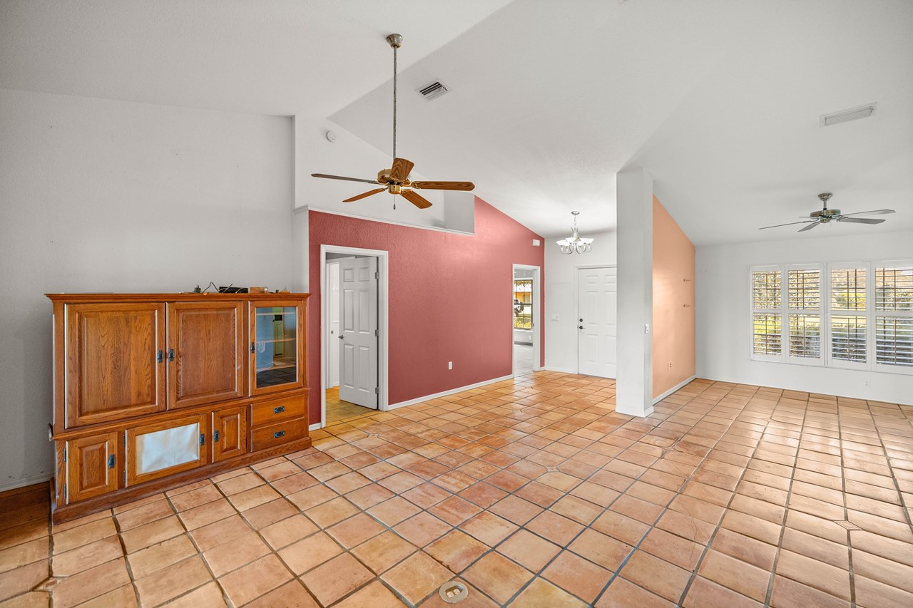volume ceilings and tile floors throughout entry, formal dining, greatroom and kitchen areas