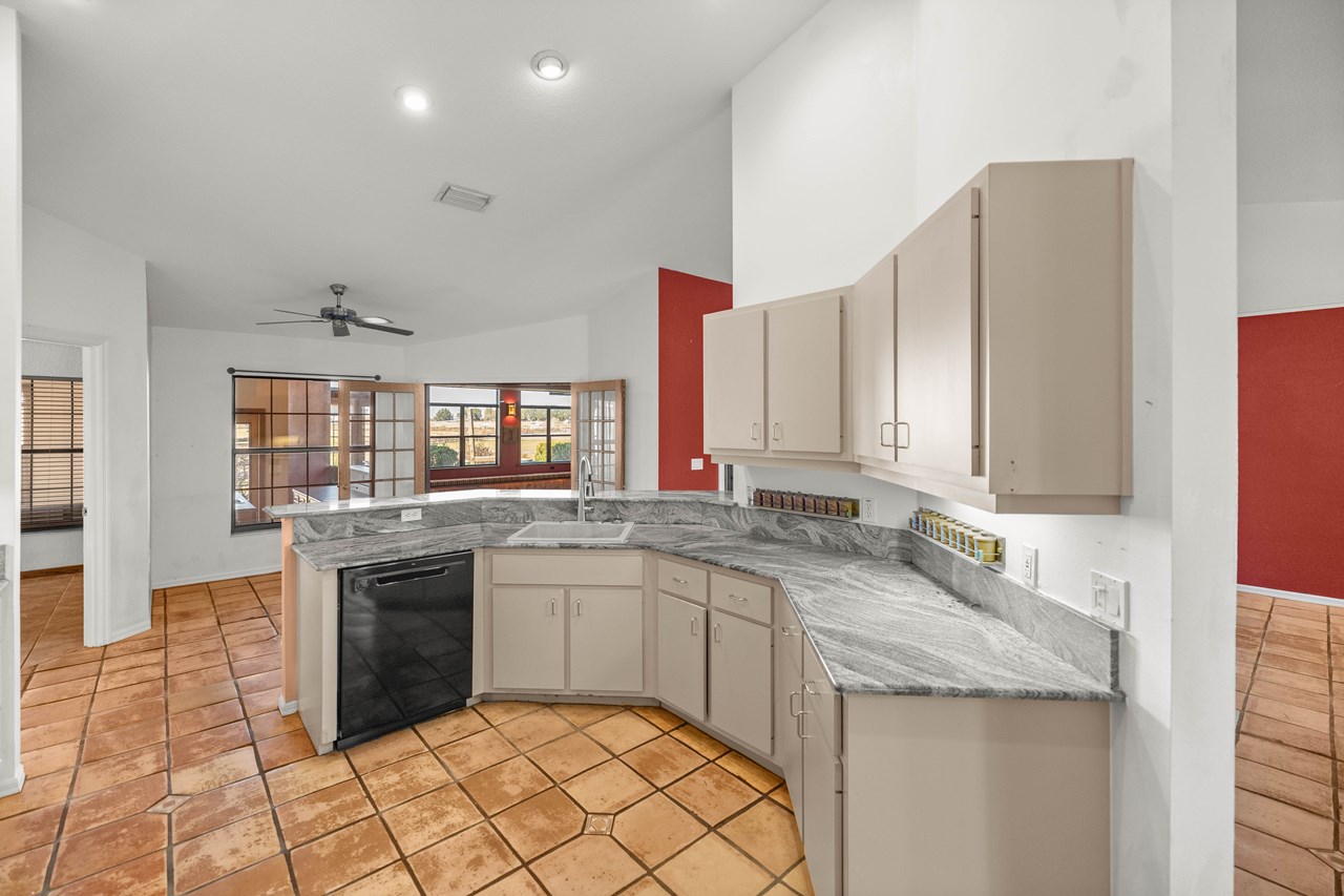 fully equipped kitchen with granite counters