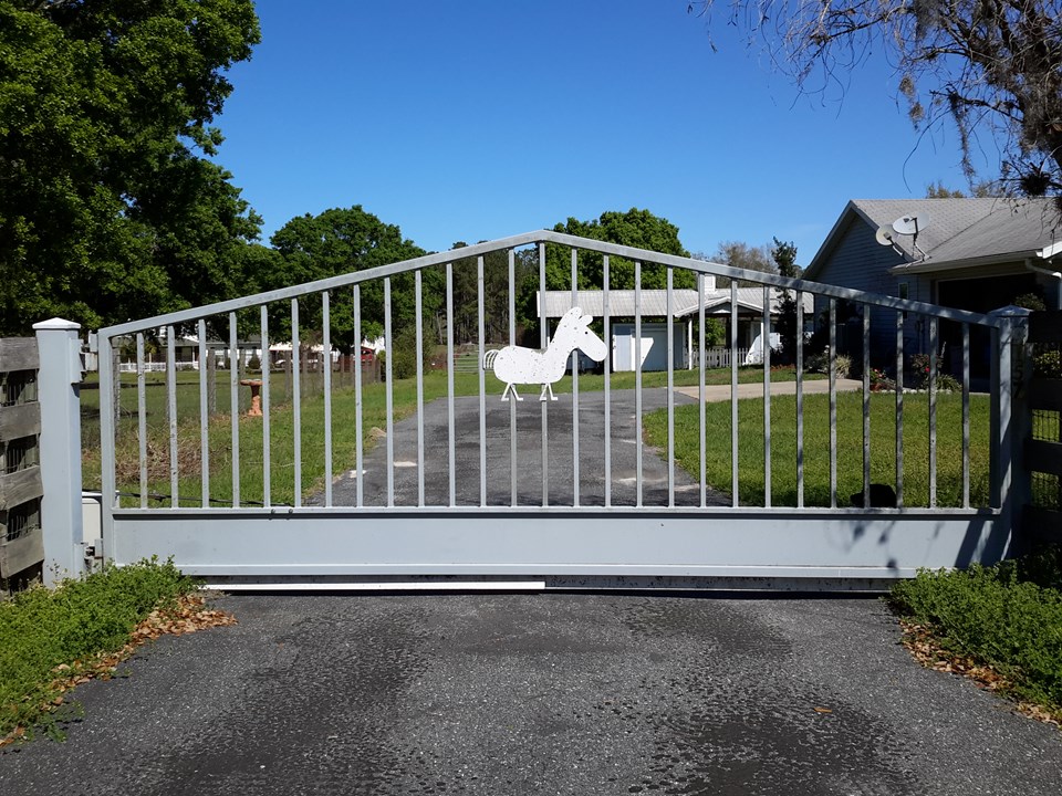paved drive and gated entry.