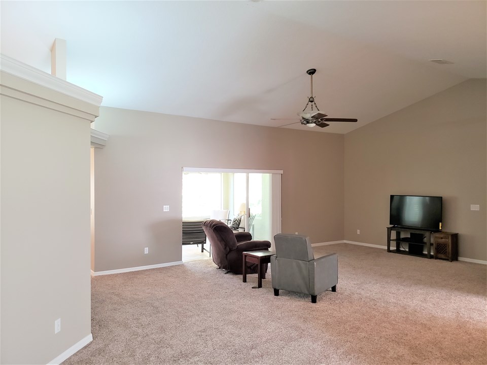spacious great room with access to the rear lanai