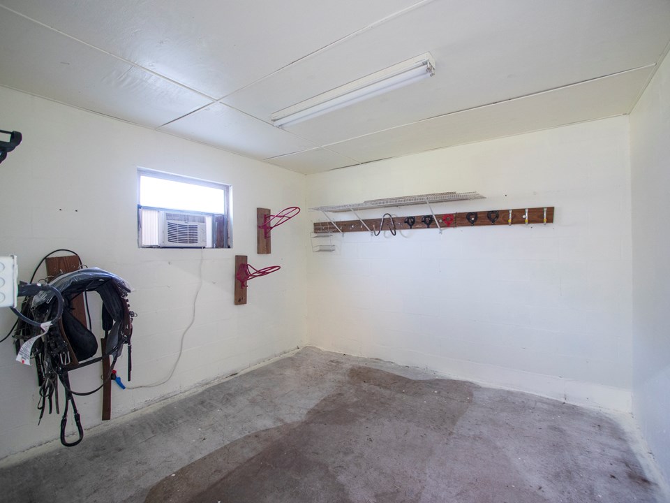 separate tack room with a few tack fixtures in place