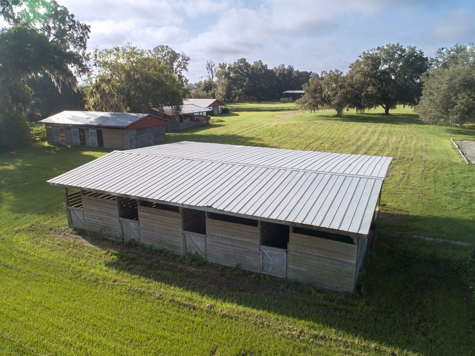three more pole barns all have electric and water and offer covered storage for a trailer and farm equipment